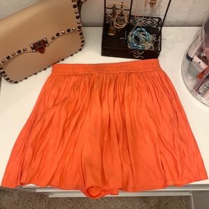 Orange skirt/shorts with pockets